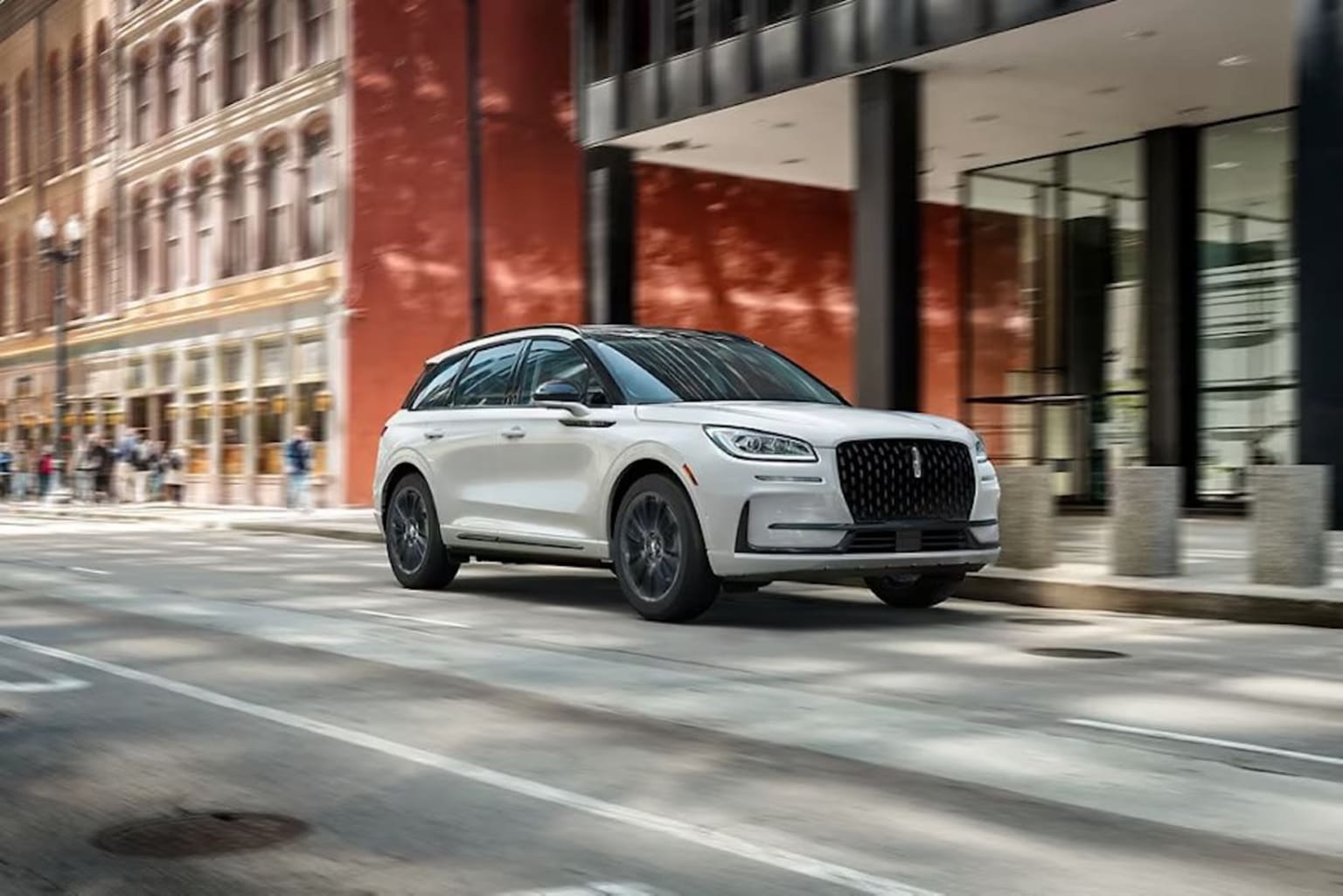 2025 Lincoln Corsair driving down the street with blurred background