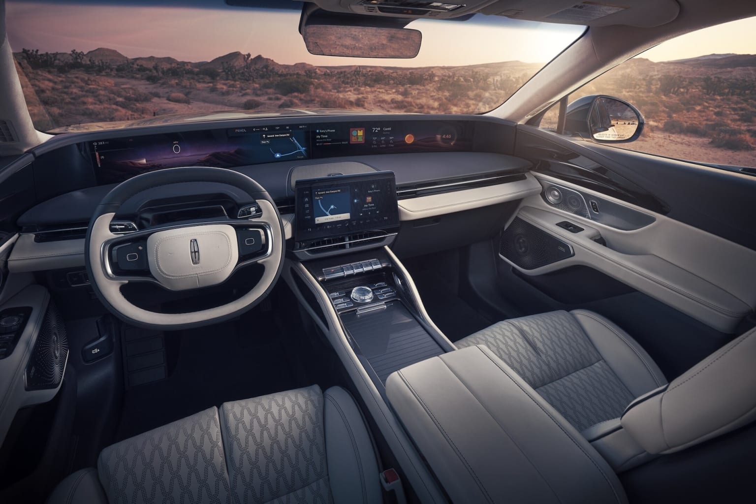 Interior of a high-tech Navigator with a sleek dashboard, digital displays, and a scenic desert landscape visible through the windshield.