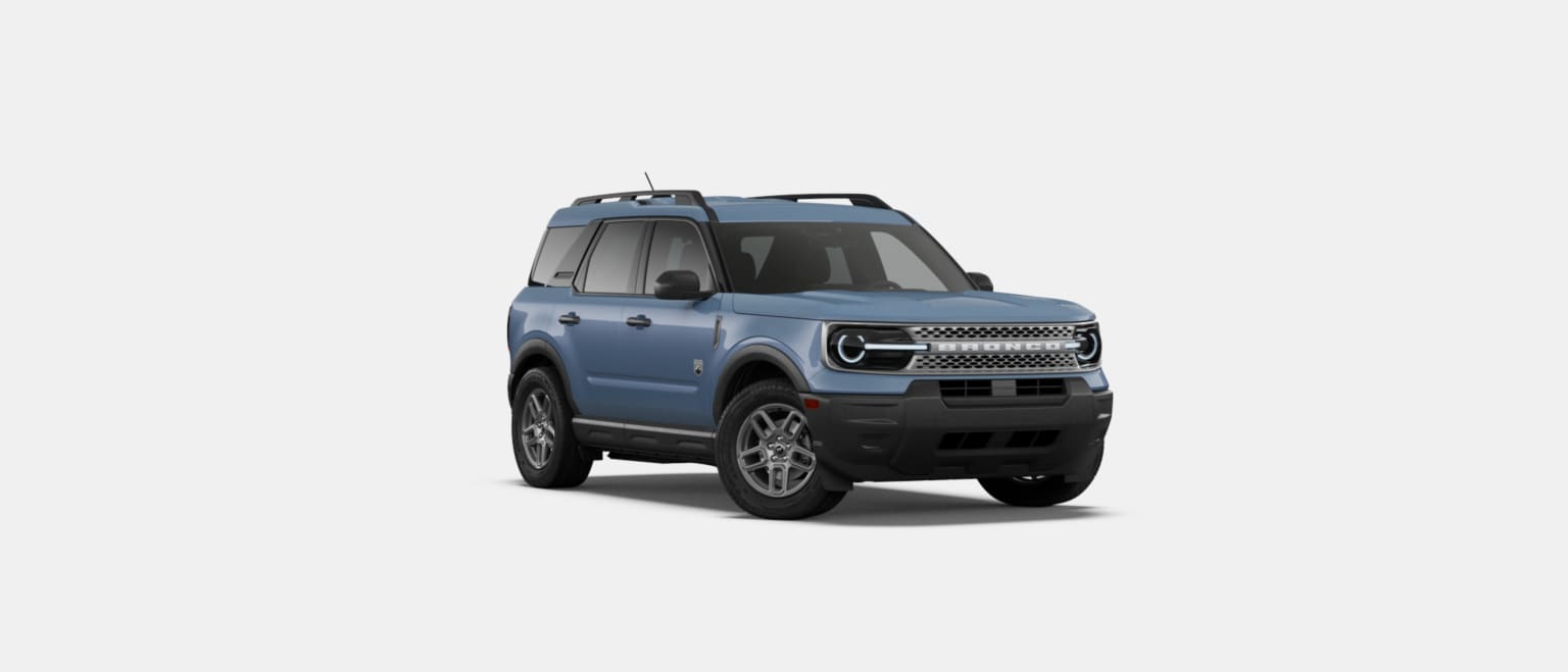 A blue SUV is positioned in the foreground against a plain white background.