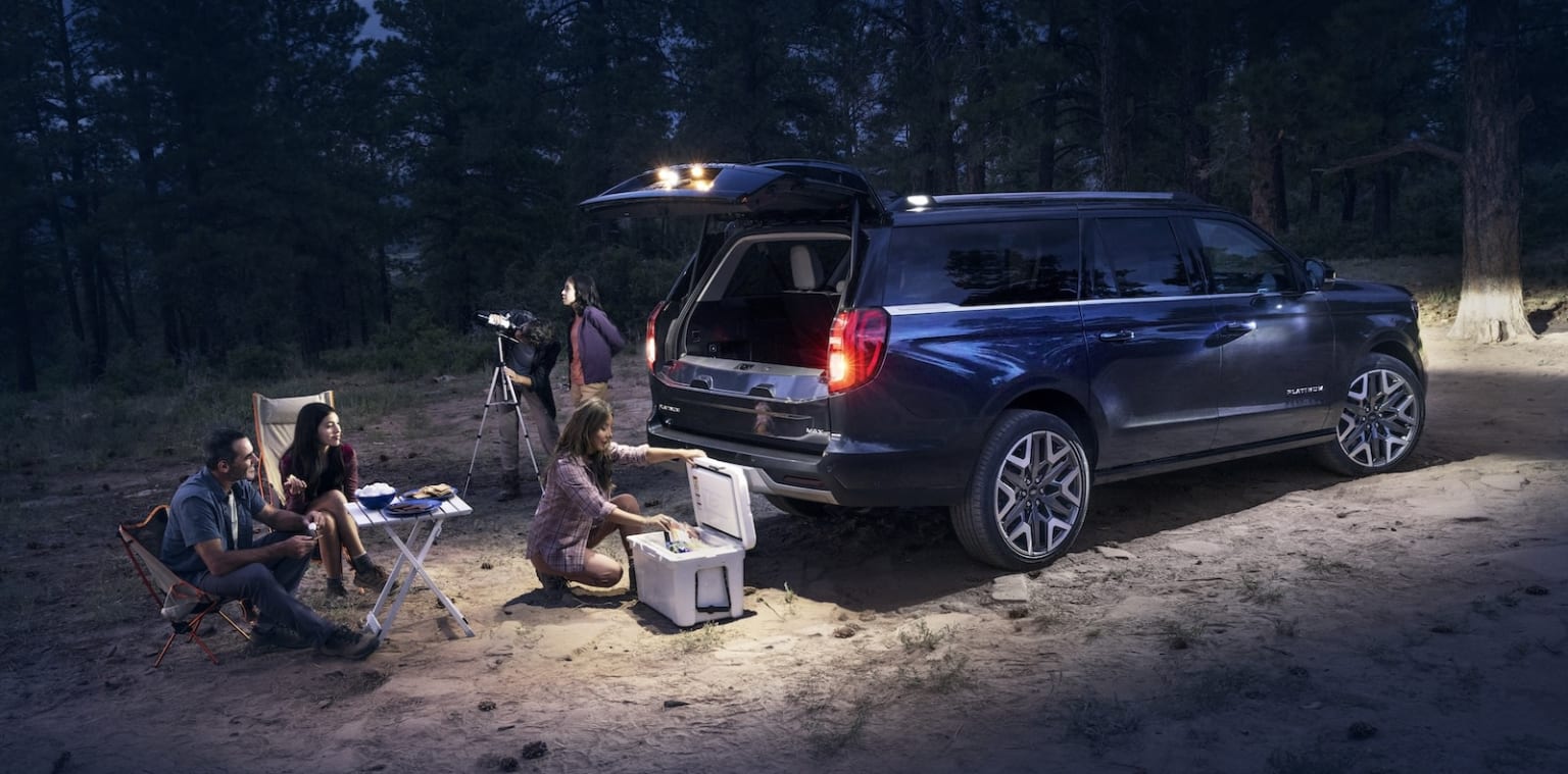 2025 Ford Expedition Platinum out camping with the hatch open illuminating the camp spot
