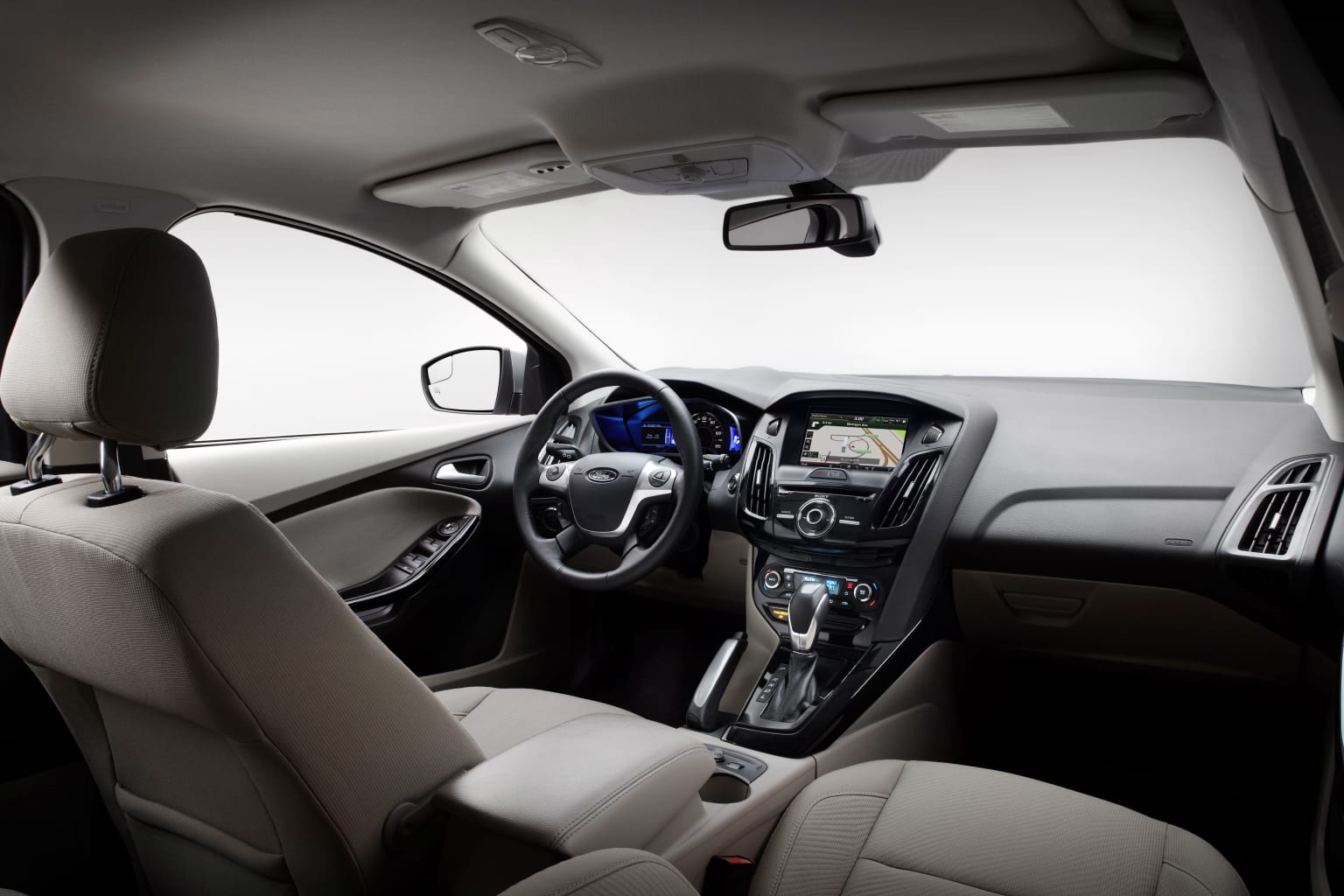 the interior of a car with a dash board and steering wheel, and dashboard lights, and a dash board