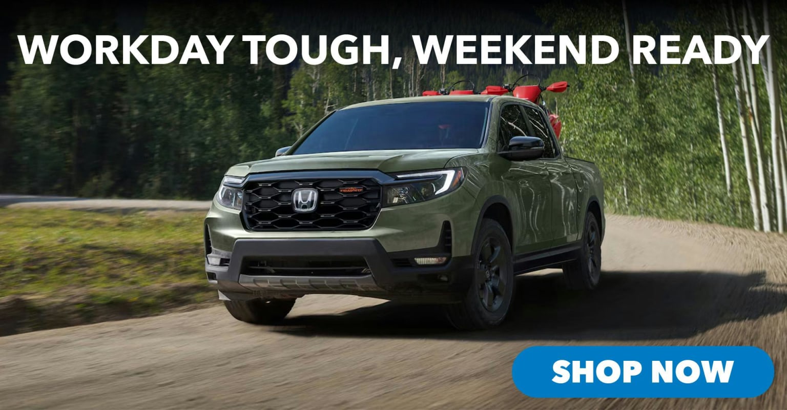 A green truck with a red rack on top parked on a dirt road in front of a forest, with the text "WORKDAY TOUGH, WEEKEND READY" above it and a "SHOP NOW" button below.