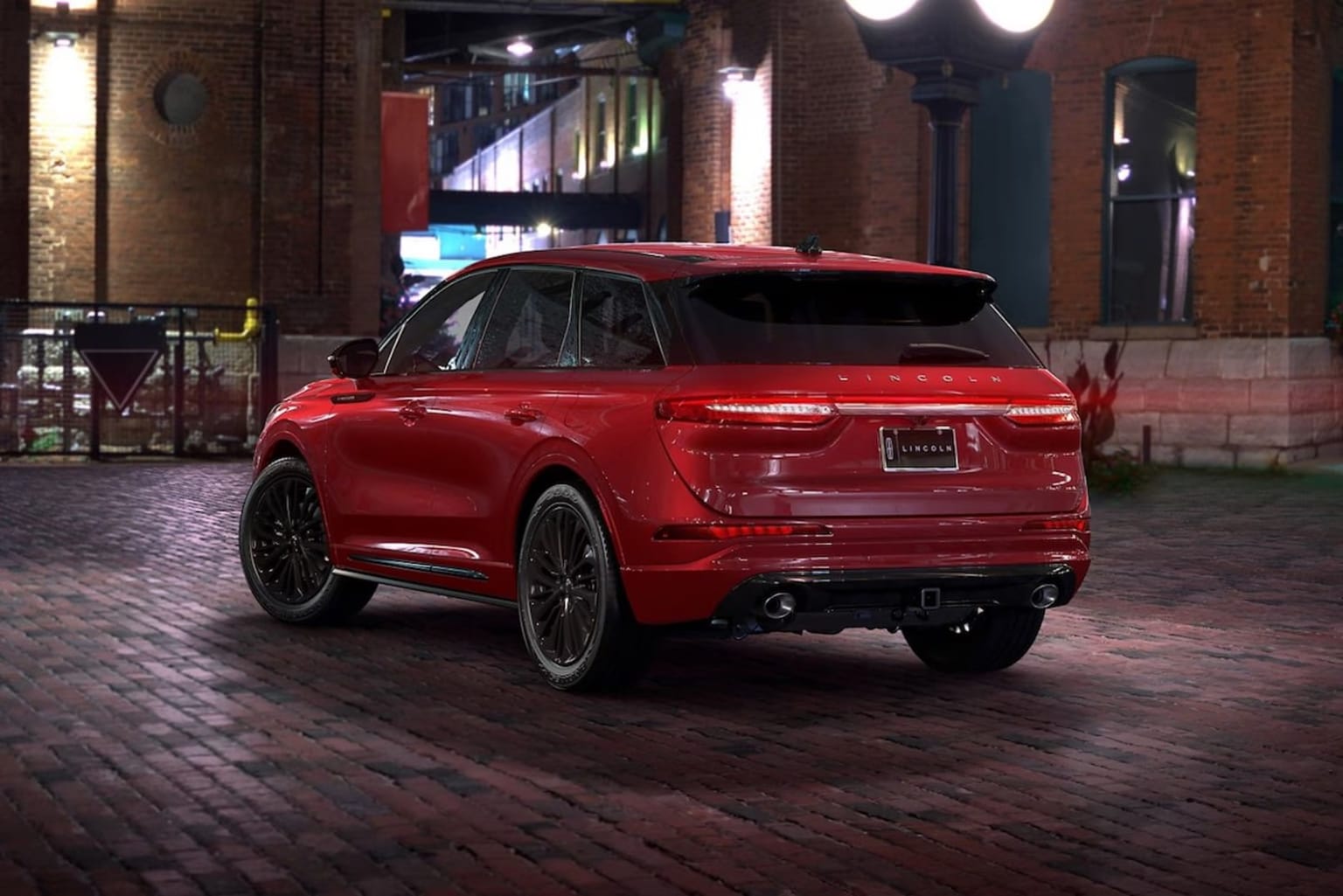 2025 Lincoln Corsair rear view of a parked car in red exterior on brick alley