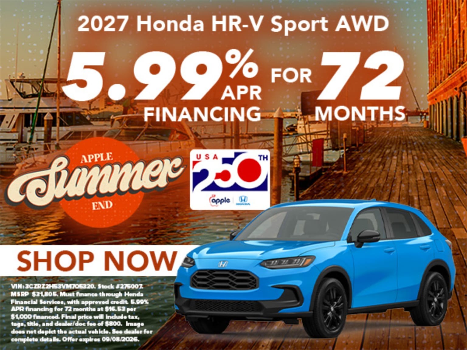 A blue SUV with all-wheel drive is displayed on a waterfront background with boats.