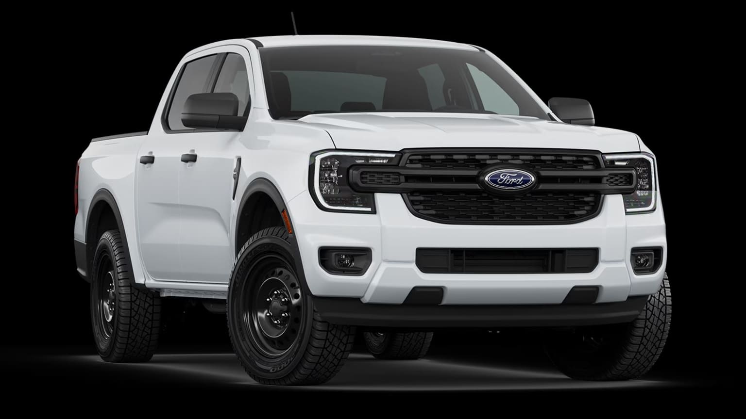 A white pickup truck with a rugged, off-road appearance stands prominently against a dark background, showcasing its powerful and adventurous design.