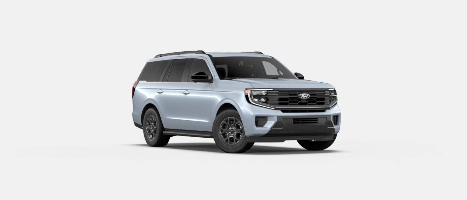 A silver-colored SUV with a bold front grille and distinctive design features against a plain white background.