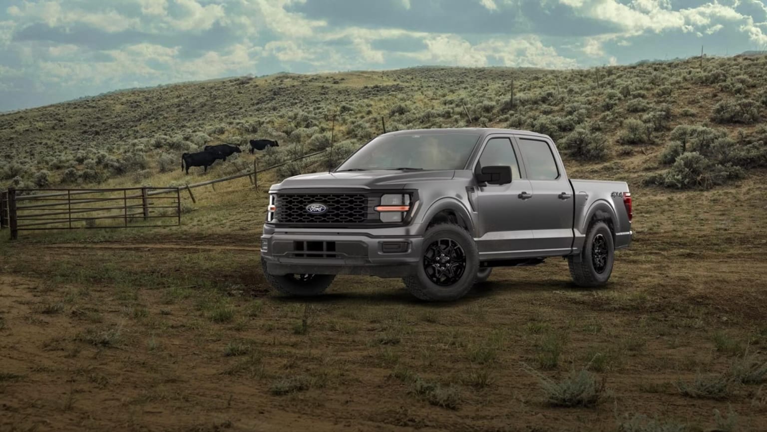 A gray pickup truck sits in a grassy field with rolling hills and cattle in the background under a cloudy sky.