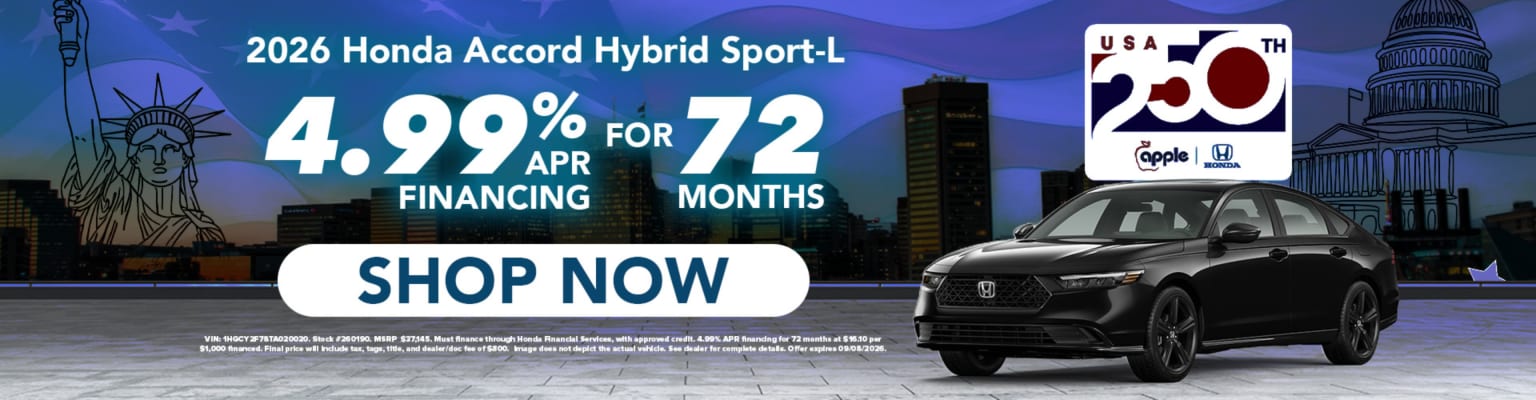 A black hybrid sedan is advertised with financing options for 72 months, set against a backdrop of iconic American landmarks like the Statue of Liberty and the Capitol Building.