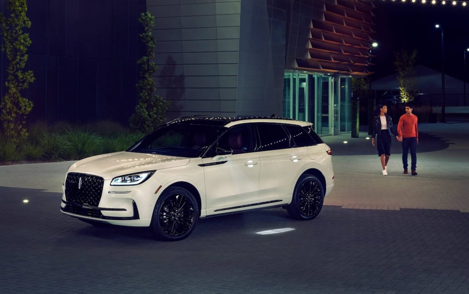 2025 Lincoln Corsair parked outside with two people walking toward it
