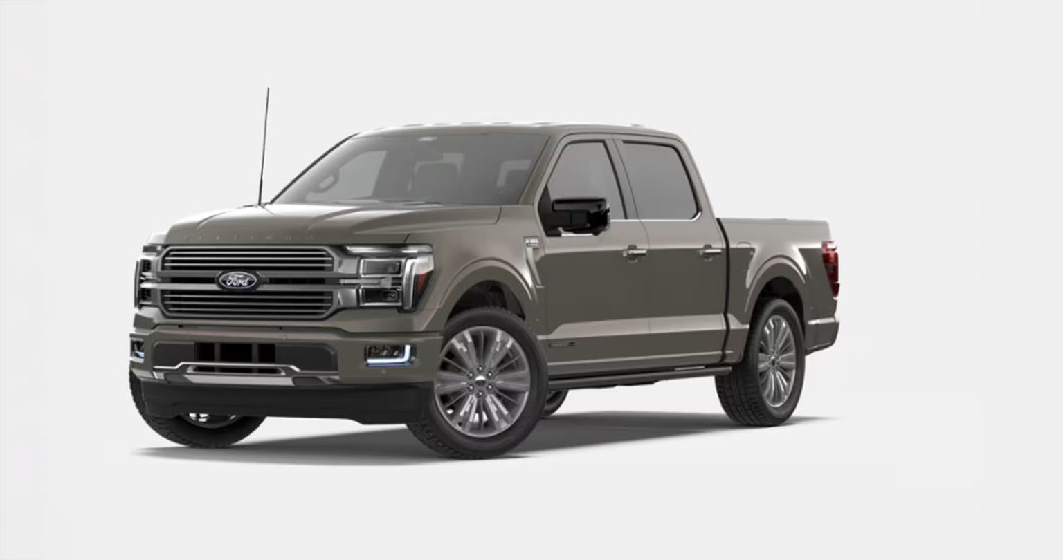 A large, gray pickup truck with a prominent grille and sleek design, set against a plain white background.