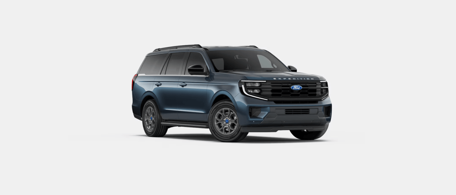 A dark blue SUV is presented against a plain, light gray background.