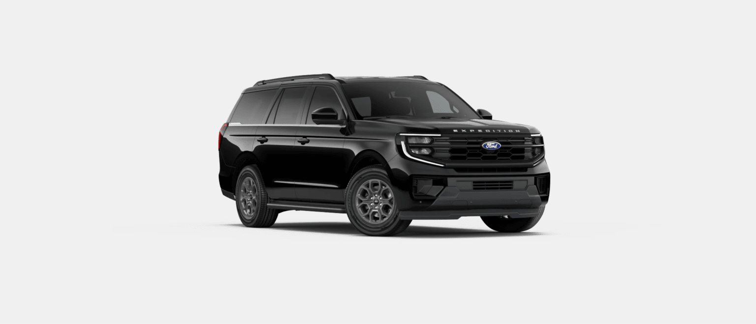 A black SUV is centered in the foreground against a plain, light gray background.