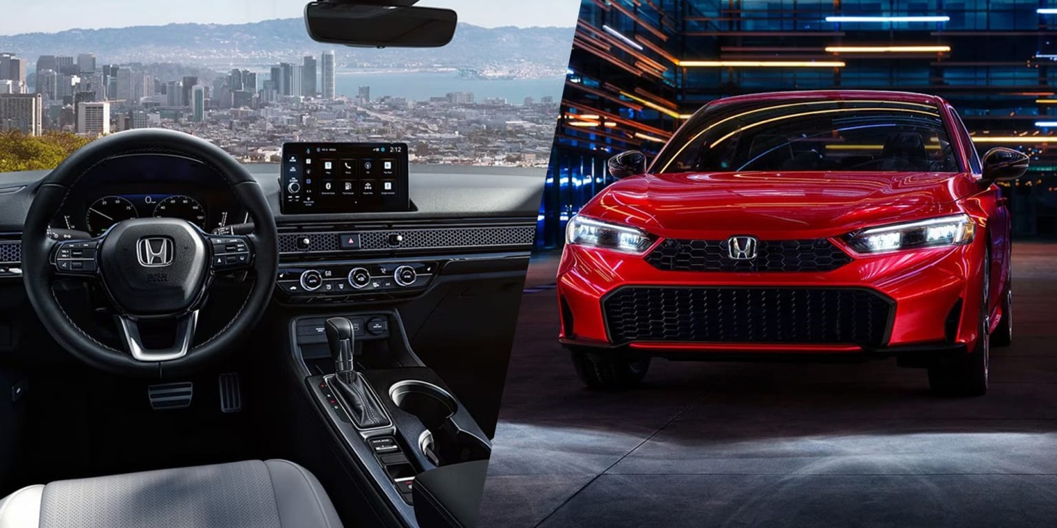 Interior of a car with a steering wheel and dashboard, with a red car parked in front of a city skyline at night.