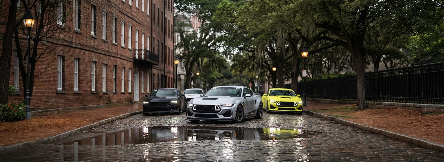 Image of a rainy street with parked cars reflecting in puddles, including a black SUV and a bright yellow compact car.