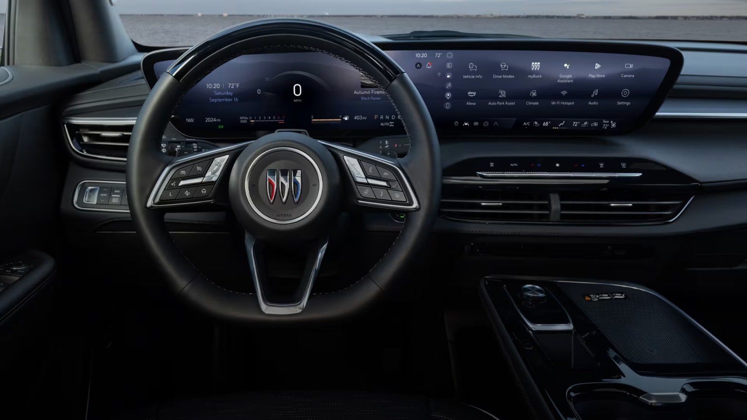Interior of a modern car with a sleek and minimalist dashboard design featuring a large digital display, a steering wheel with various controls, and a center console with additional buttons and knobs.