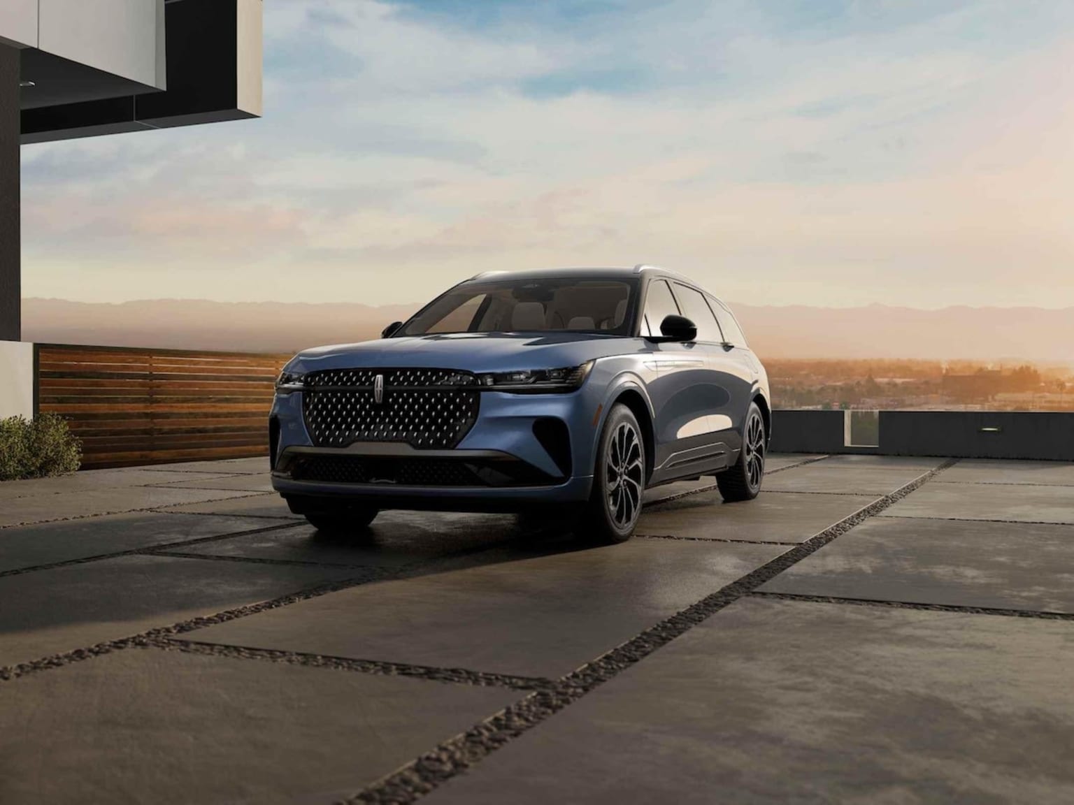 2025 Lincoln Nautilus parked in a driveway overlooking a city