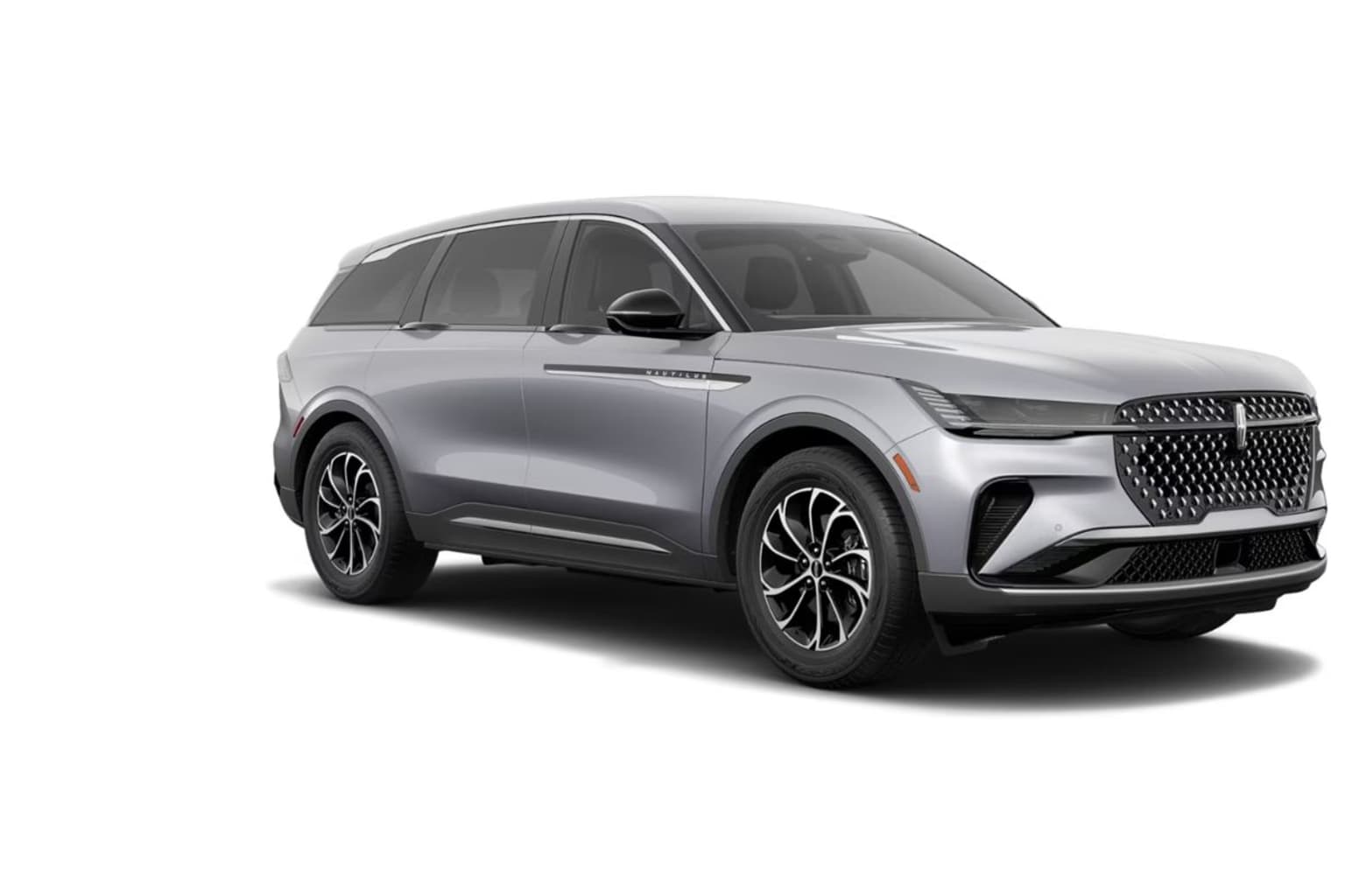 A sleek, silver SUV with a bold, angular design and distinctive grille stands prominently against a plain white background.