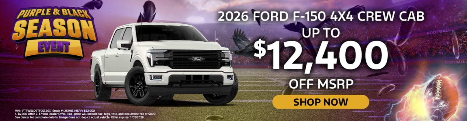 A white pickup truck is parked in front of a crowded football stadium under a purple-tinted sky.