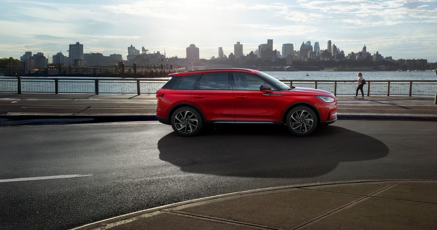 Side view of a 2026 Lincoln Corsair specs parked by a river overlooking Savannah, GA