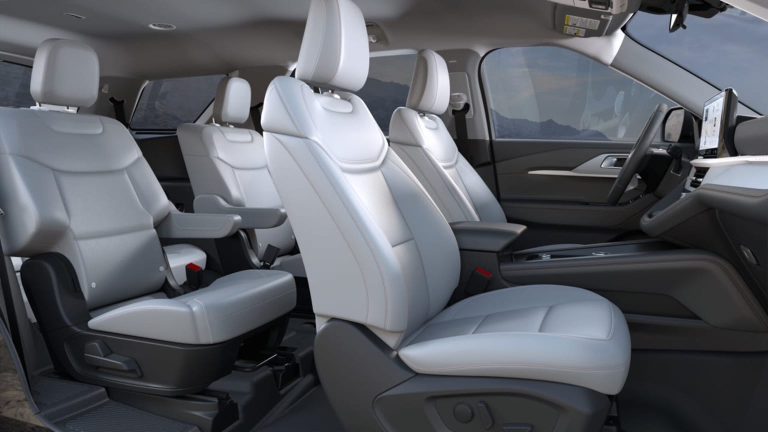 Interior of a vehicle with white leather seats and a spacious cabin.