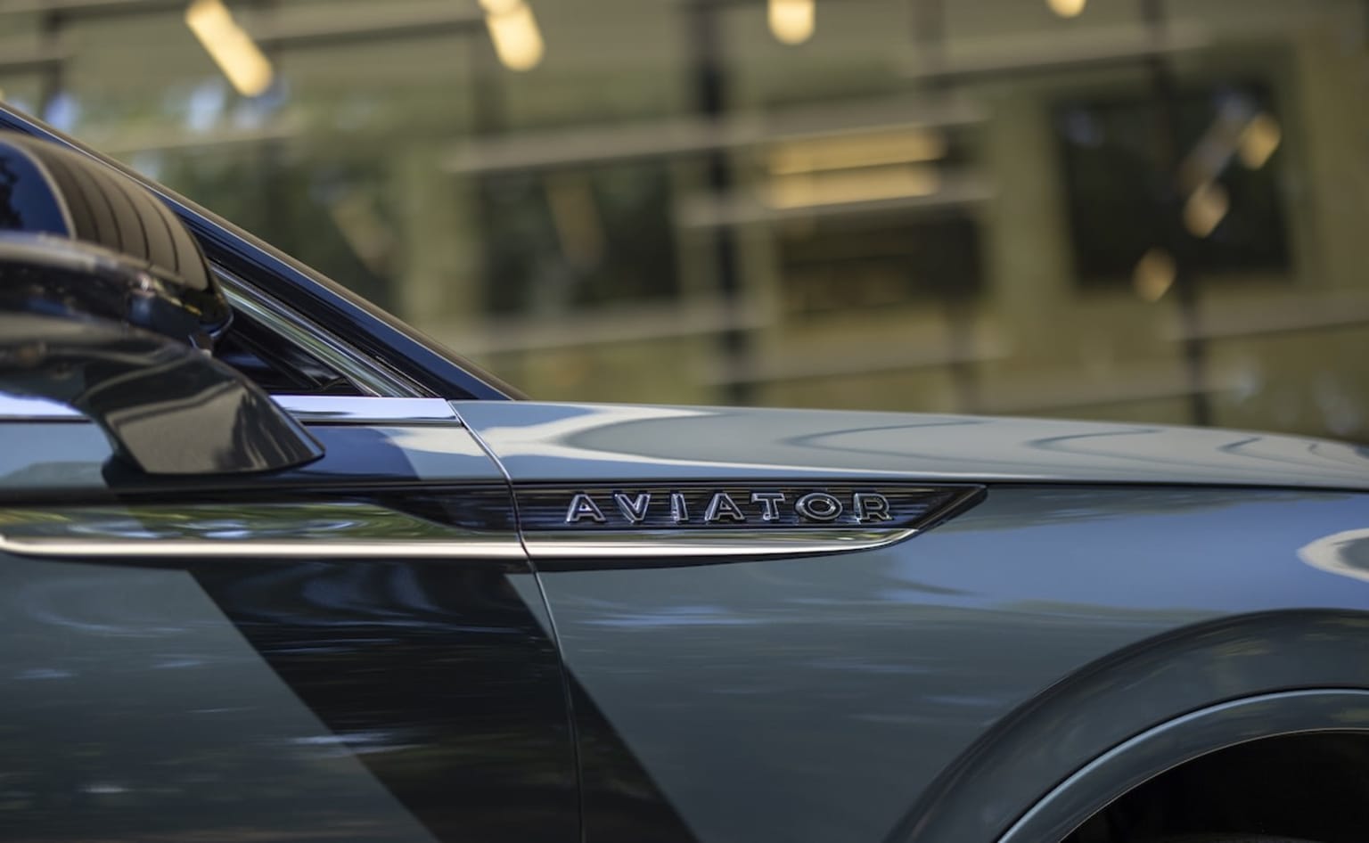 Lincoln Aviator side few with the Aviator emblem under the side mirror