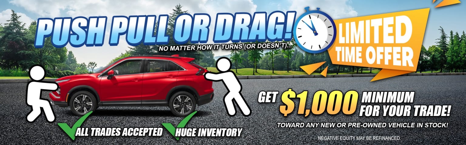 The image shows a red car in the foreground with a billboard in the background advertising a promotion that offers $1,000 towards any new or pre-owned vehicle purchase, regardless of the vehicle's condition.