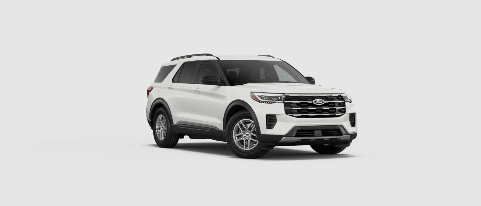 A white SUV parked against a plain, light gray background.