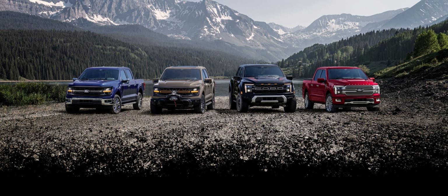 2026 Ford F-150 line up parked on a gravel hill with mountains in the background
