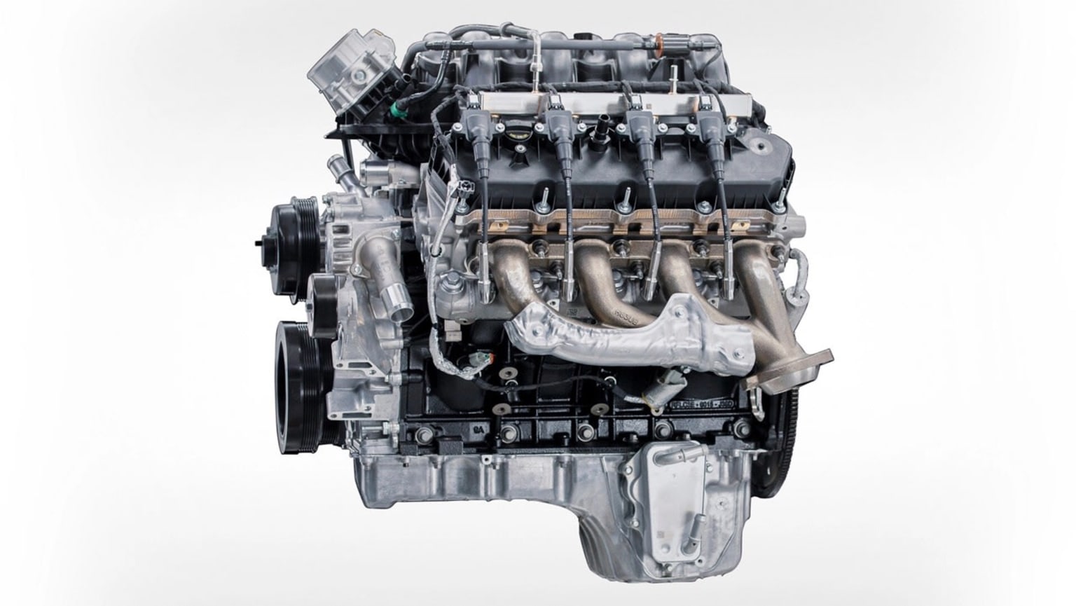 Image of a car engine, showcasing its intricate internal components and mechanical structure. The engine is a complex and powerful unit, with multiple cylinders, valves, and other intricate parts visible in the foreground.