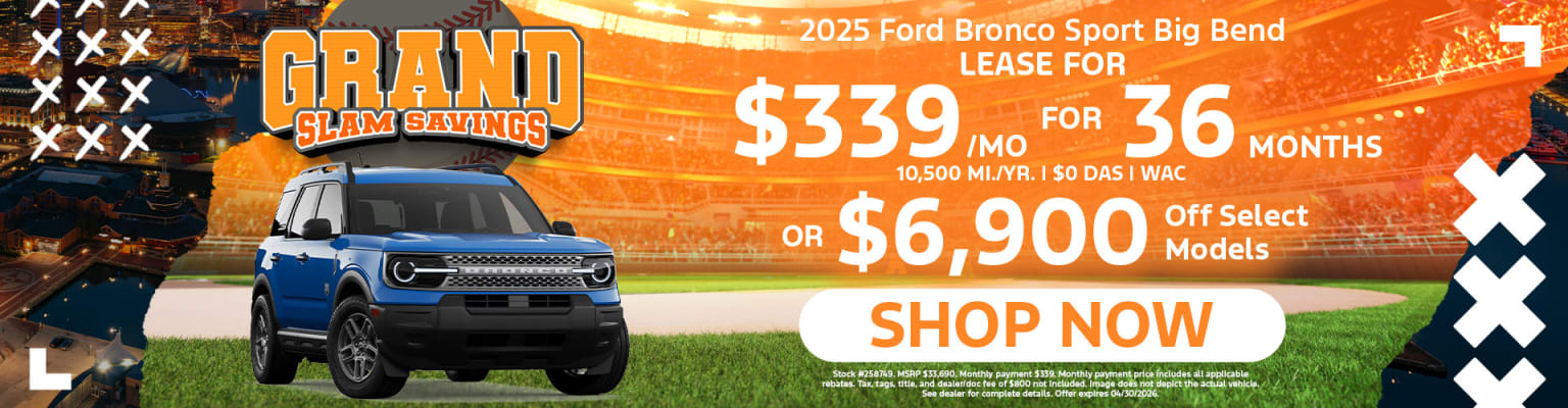 The image shows a SUV in the foreground with a background of a sports stadium or field, indicating suitability for outdoor activities.