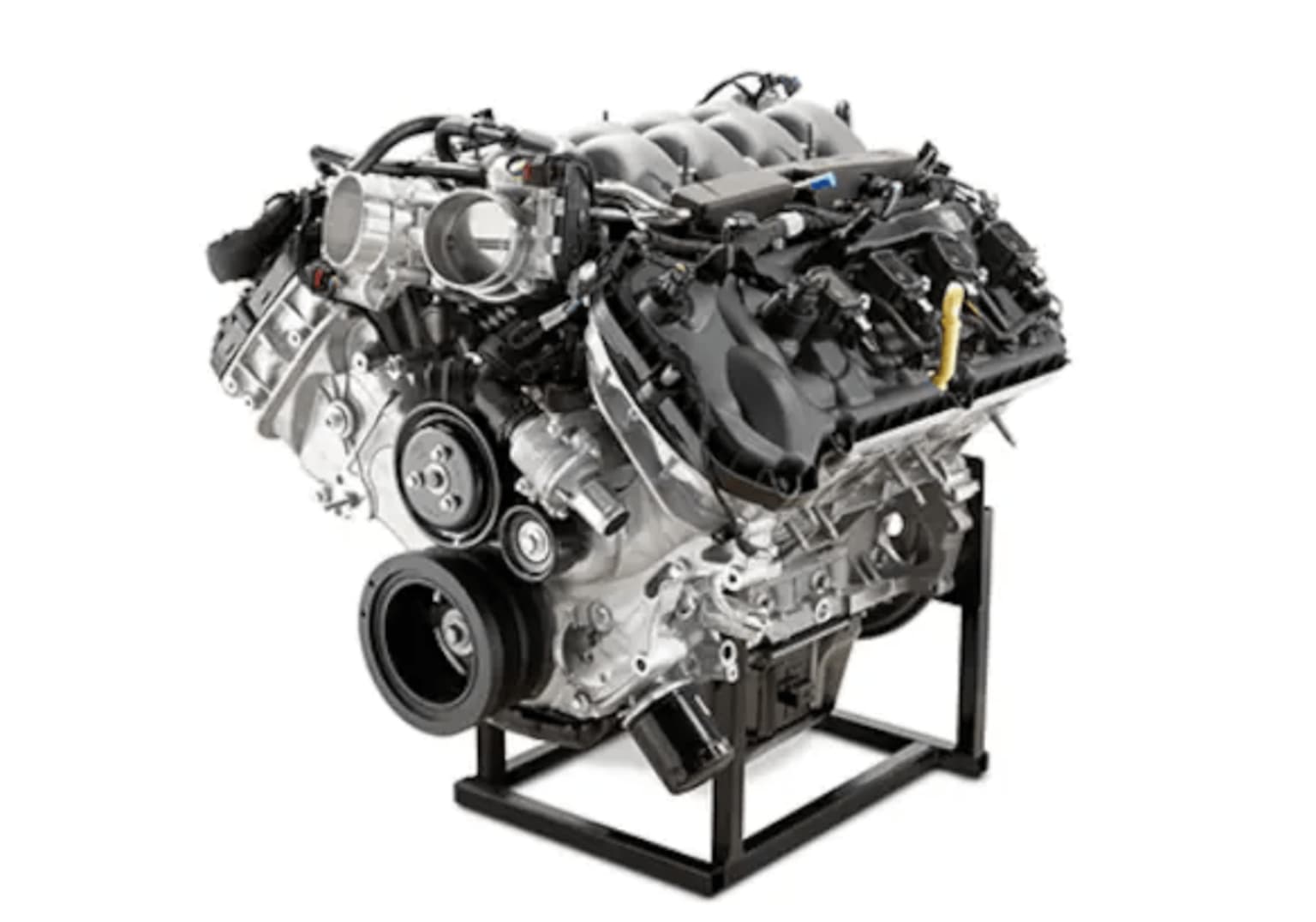 V8 engine on black metal stand against white background.