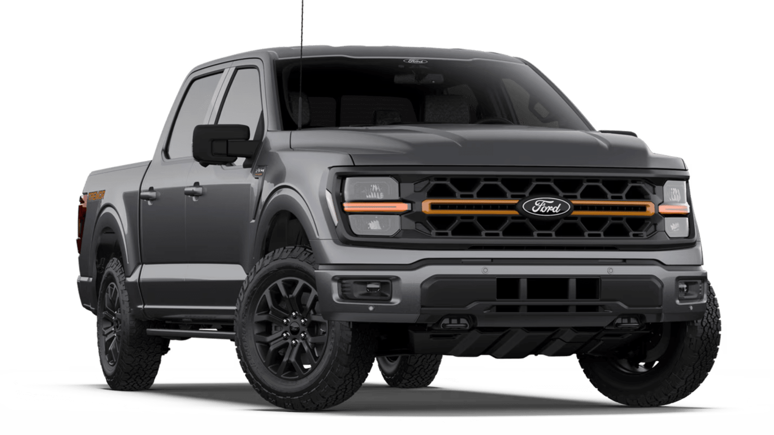 A dark gray truck with an orange-accented grille sits on a white background.