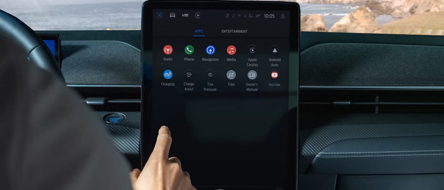 Interior of a vehicle with smartphone screen and icons displayed.