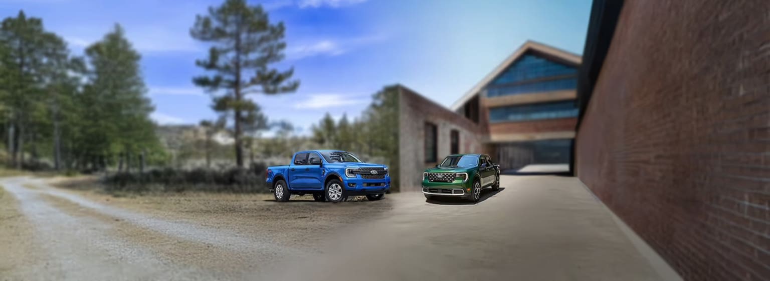 Ford Maverick vs Ranger parked on a dirt road in front of a large building with a wooded area in the background.