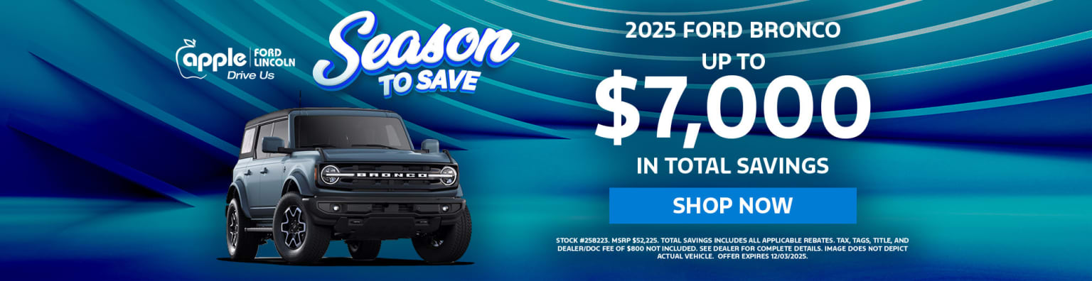 A black SUV model displayed in the foreground, with a blue background showcasing a promotional offer for savings on the vehicle.