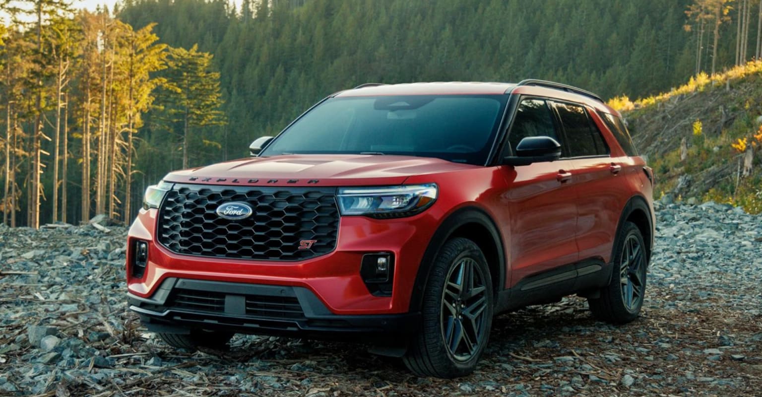 Red SUV in forest setting