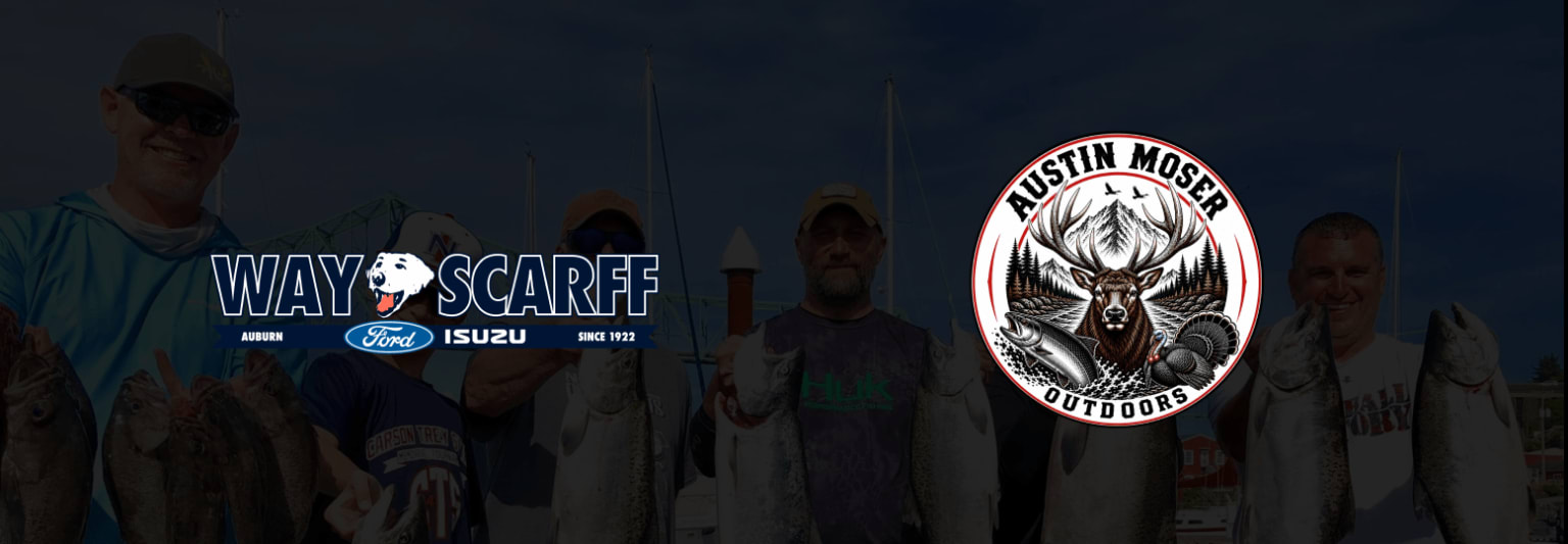 Several people are holding fish in front of a dark background.