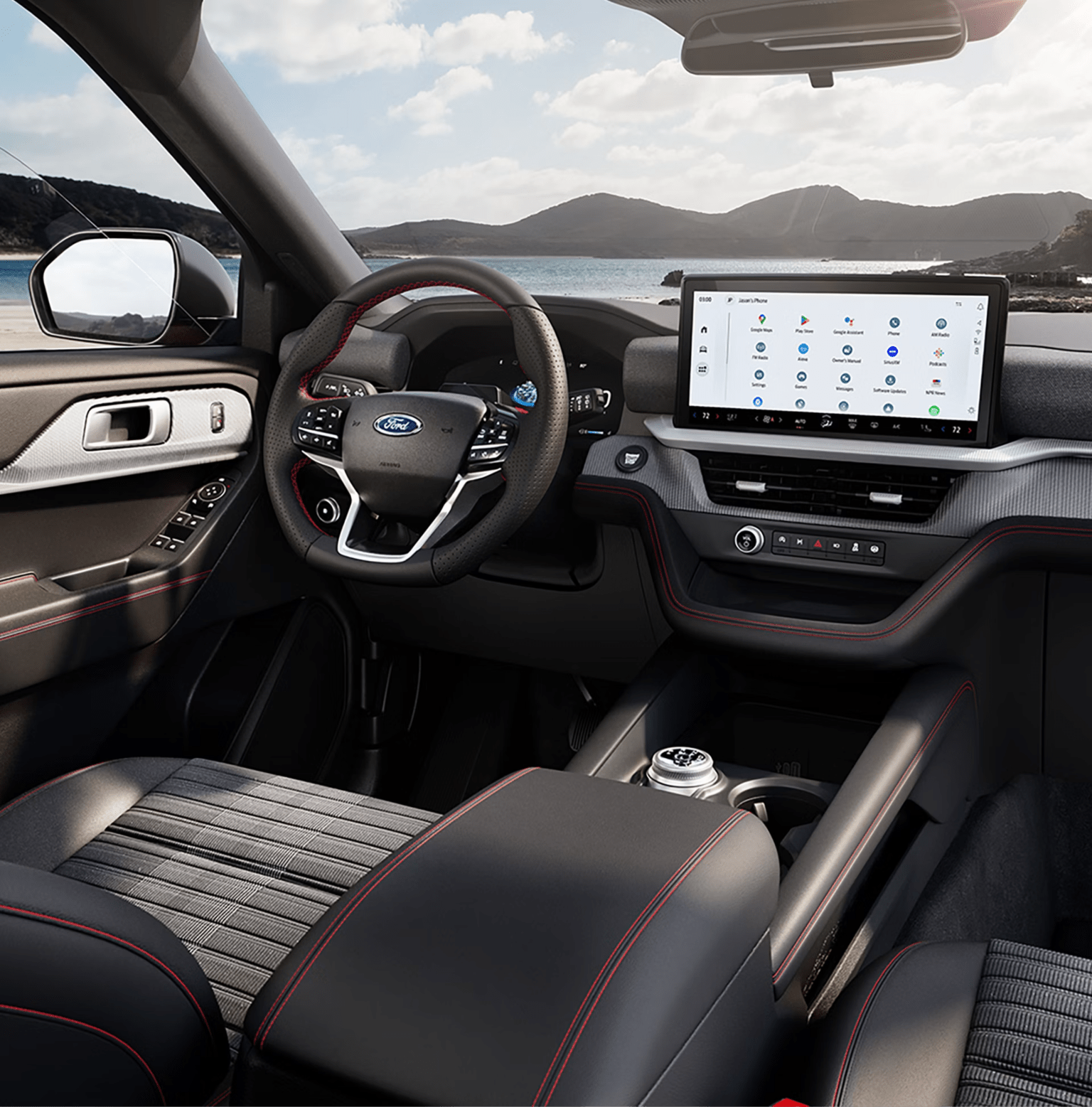 Modern interior of a vehicle with red stitching and a large touchscreen against a scenic backdrop.