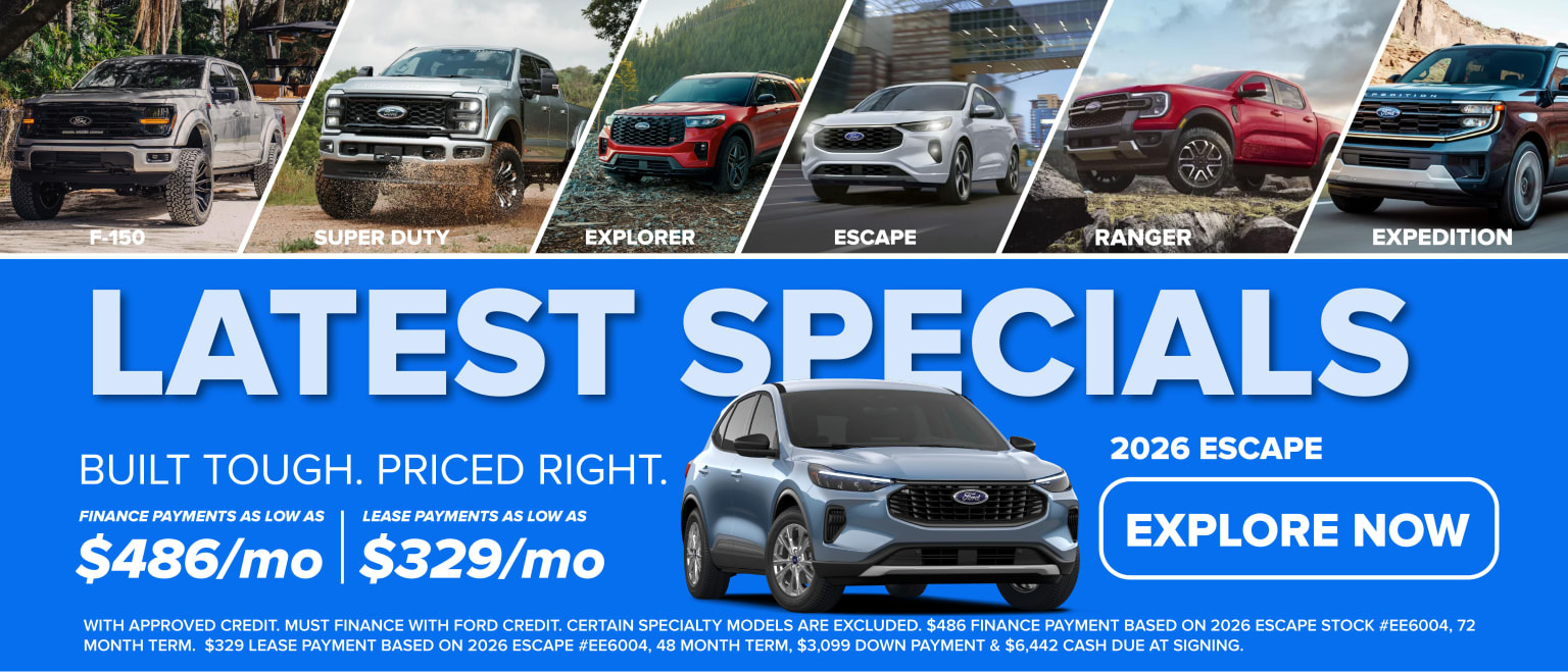 Various vehicle models displayed at a dealership, including a truck, an SUV, and a crossover.