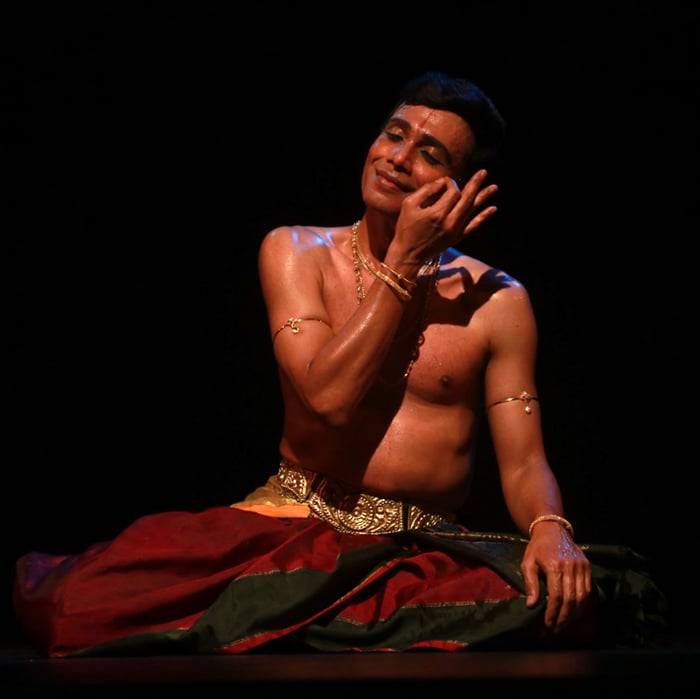 Seshadri Iyengar seated in a dance pose