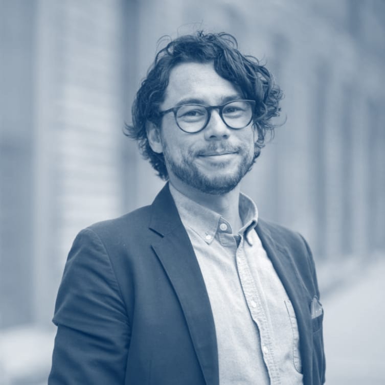  Charles Amyx standing along the Argus Building on 4th Street in Ann Arbor, MI