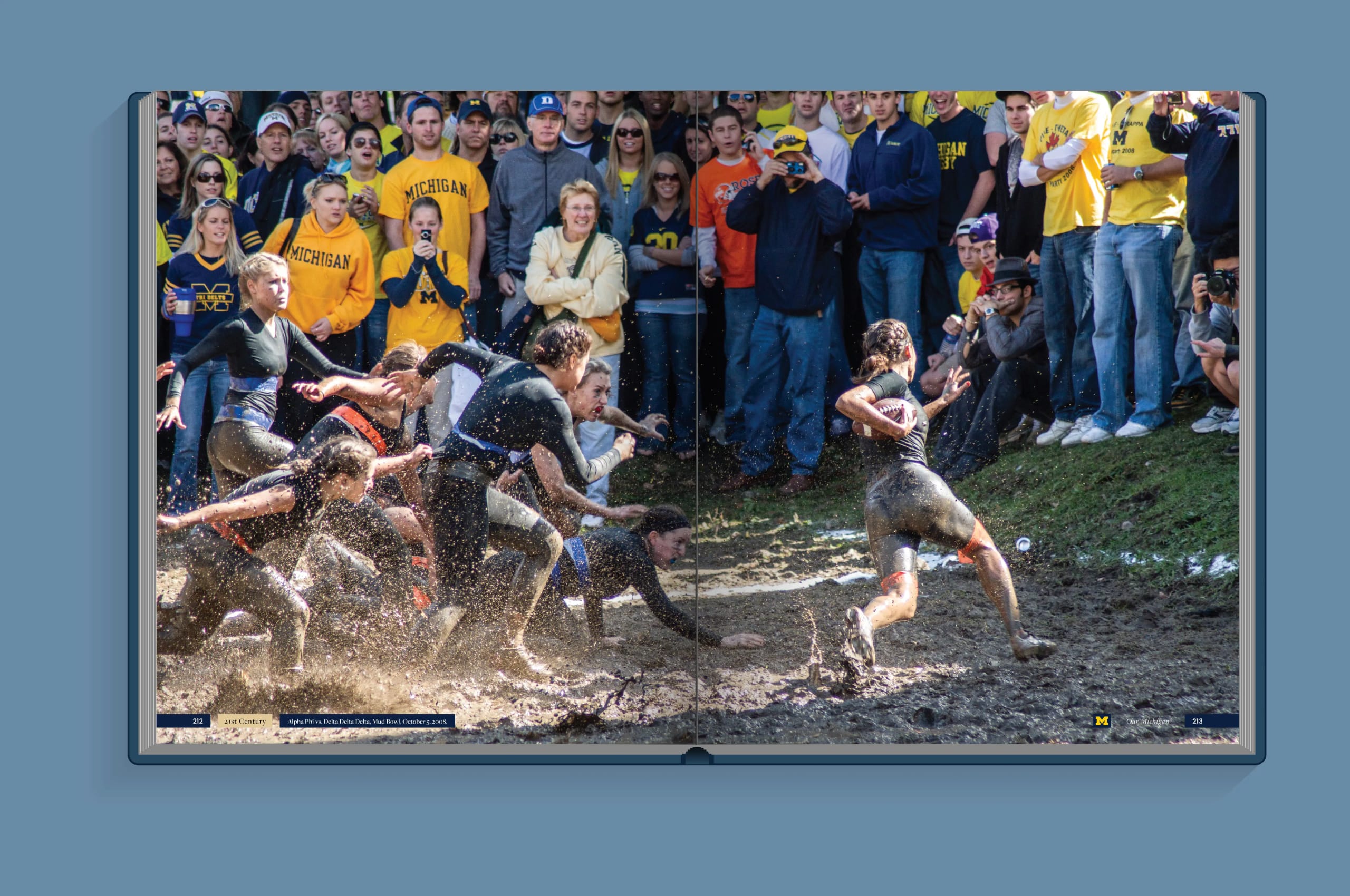 Students at U-M play football on a muddy field