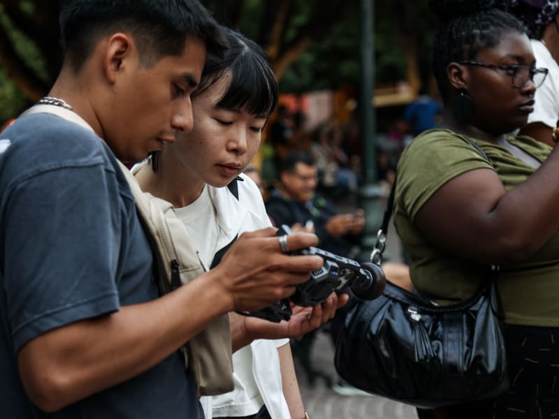A group reviewing footage together during a filming day