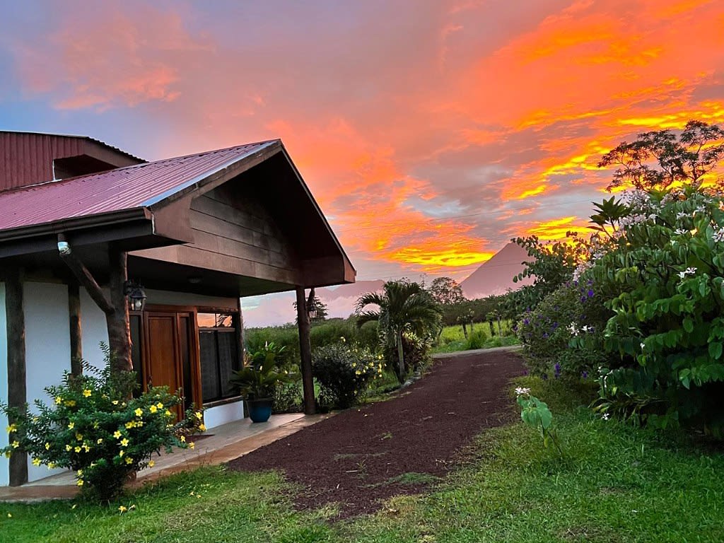 Sunset in front of Villa Tucán, with Arenal Volcano.