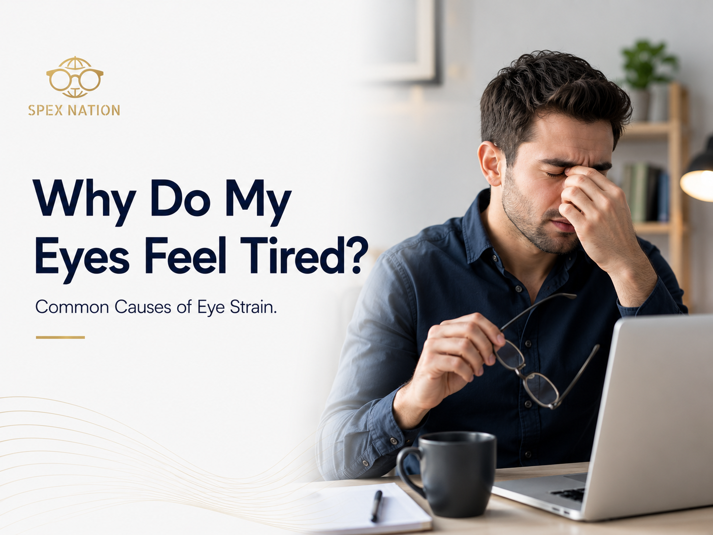 Office worker rubbing tired eyes while working on a laptop.