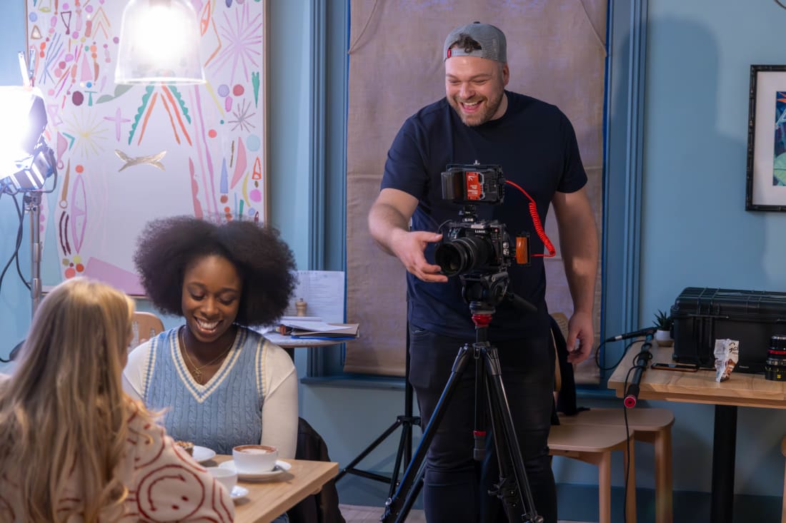 Rob Hutt filming on location at a local café in Banbury