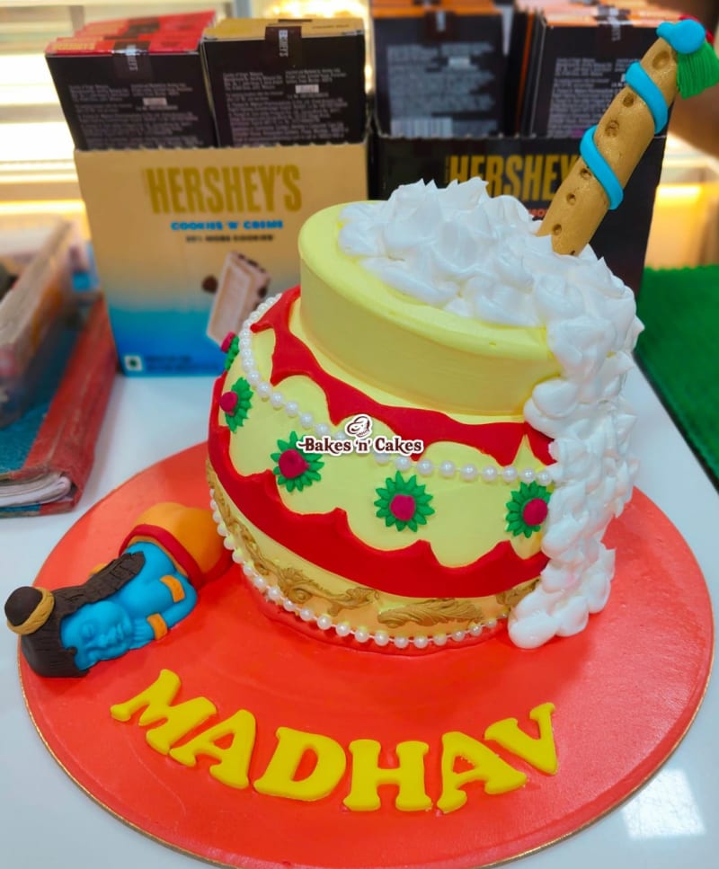 Tilted Matki Red & Yellow Krishna Cake