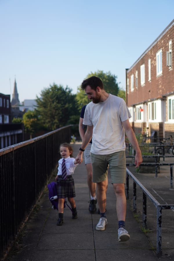 Me and Orla holding hands on our way to her first day of school