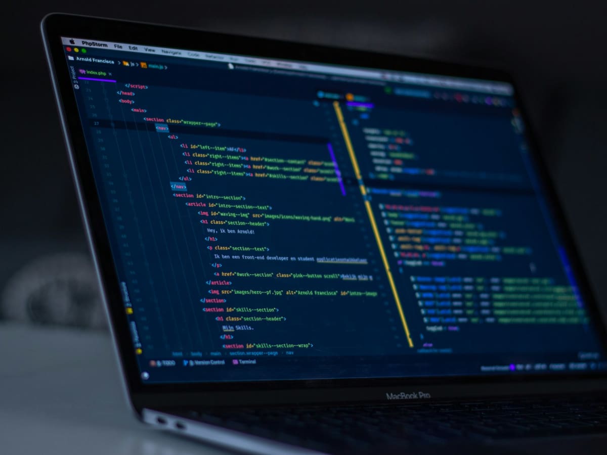 Code in a dark editor on a laptop screen