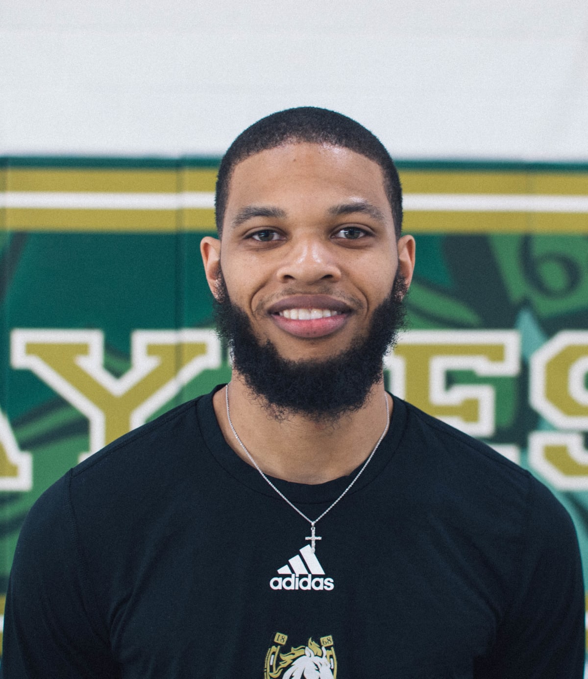 Basketball coach headshot in the gym